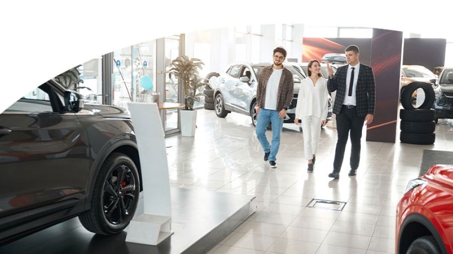 people walking in a dealership